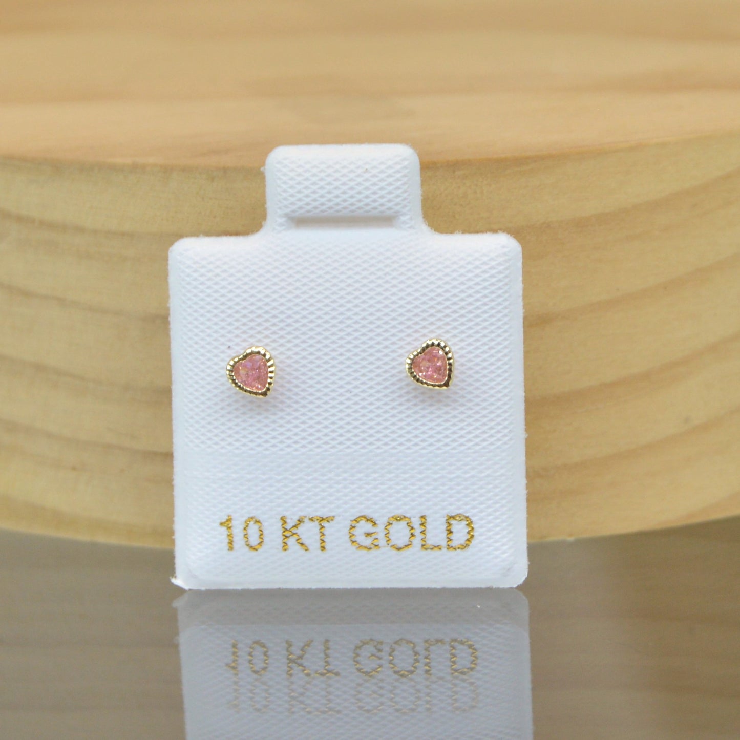 Corazón bisel mini zirconia rosa oro 10k